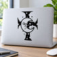 Black cross-and-moon vinyl decal on a laptop lid