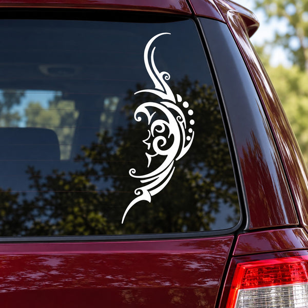 Tribal crescent moon face decal sticker, white decorative design on car window glass.