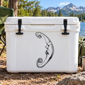 Black crescent moon decal with face and ornate swirls on a cooler