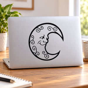 Happy moon swirls decal: black crescent with curling swirls on laptop lid