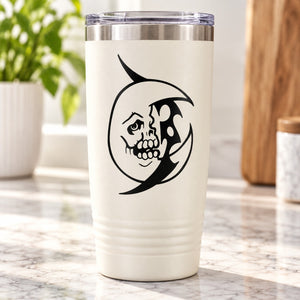 Black moon face decal on white tumbler cup