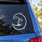 White cat-and-moon decal sticker on dark window