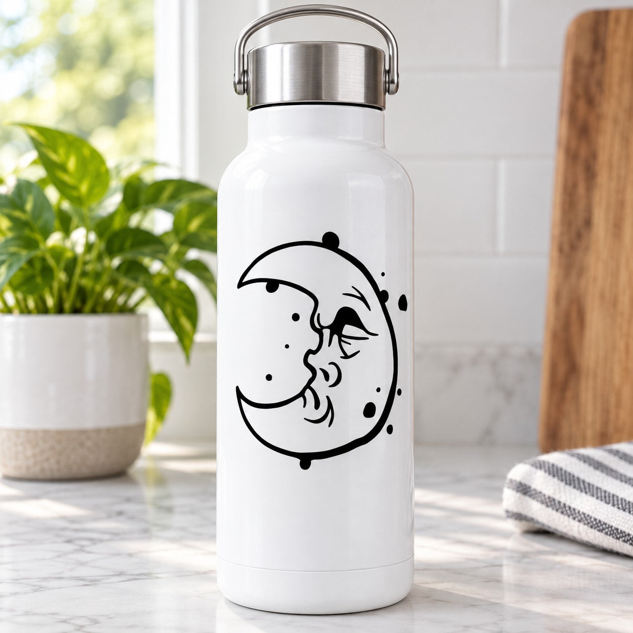 Crescent moon decal with a grouchy face, black line art on a bottle