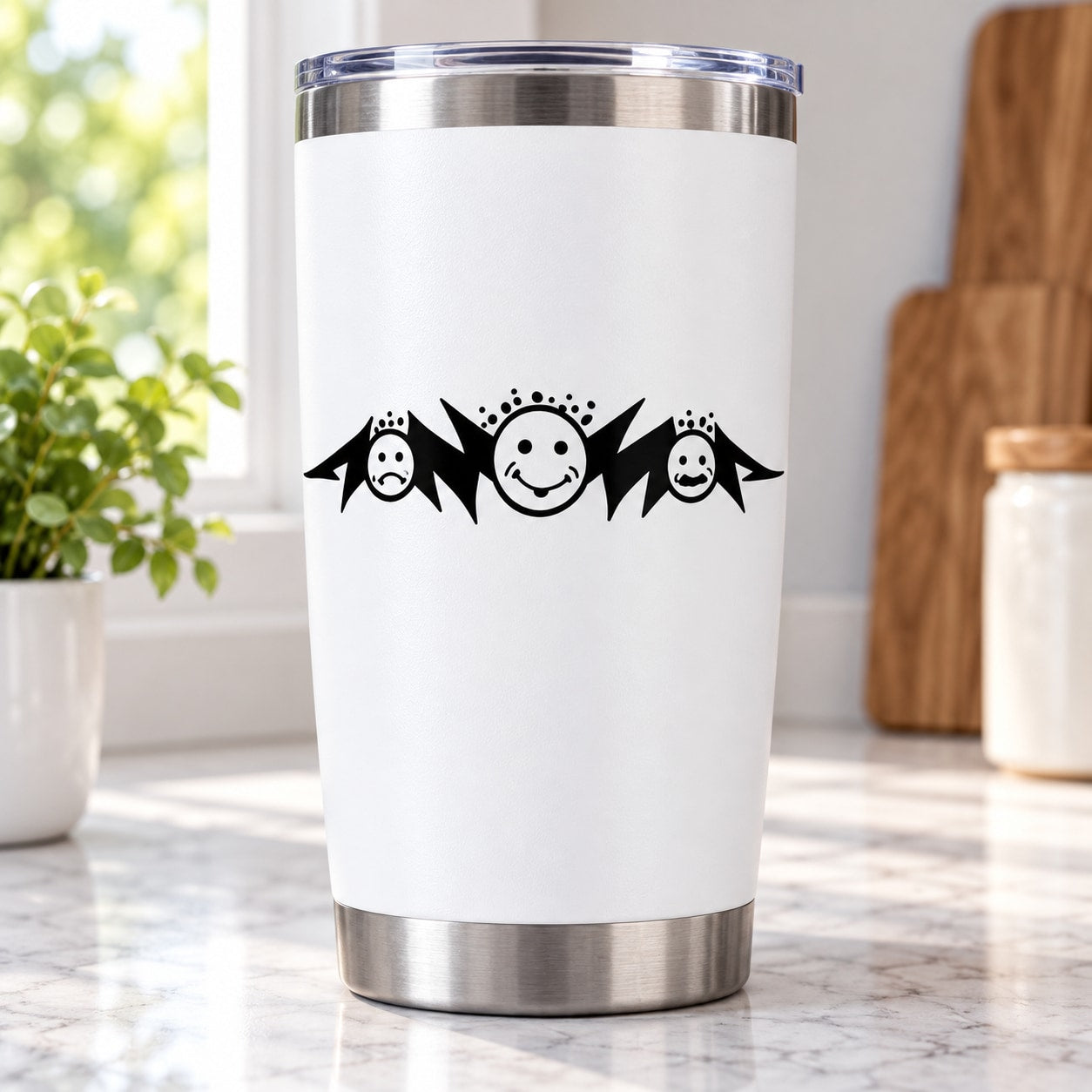 Triple-moon decal with black moon faces on white tumbler