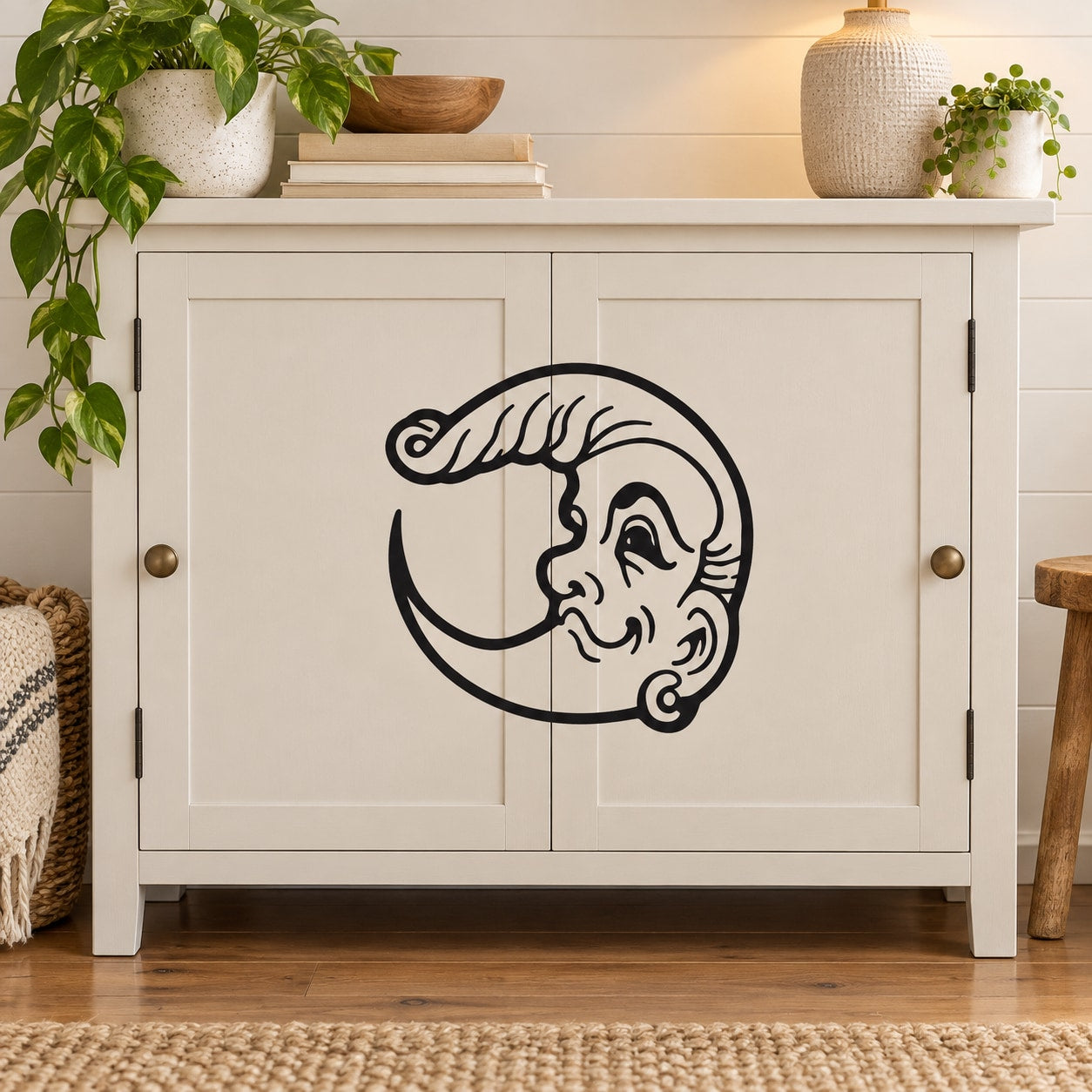 Moon wall decal with black line-art face and crescent design