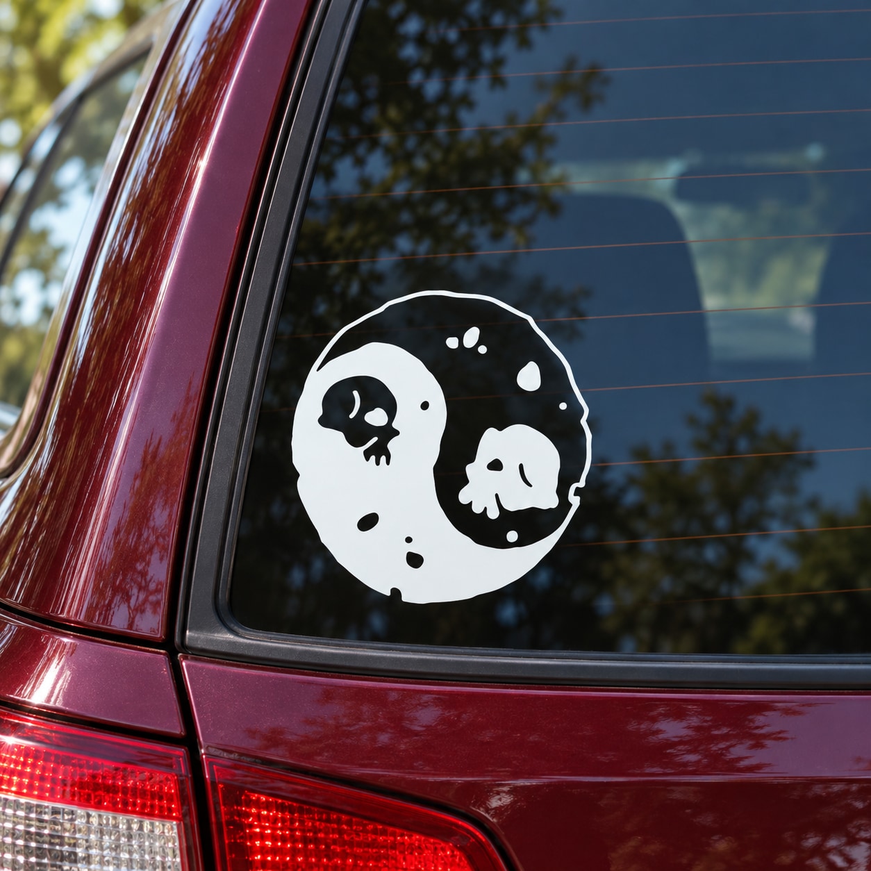 White yin-yang skull moon decal with two skulls in circular yin-yang design