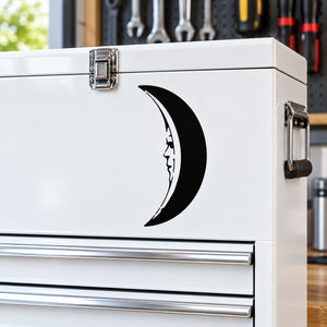 Black crescent moon face decal with stylized facial features