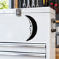 Black crescent moon face decal with stylized facial features