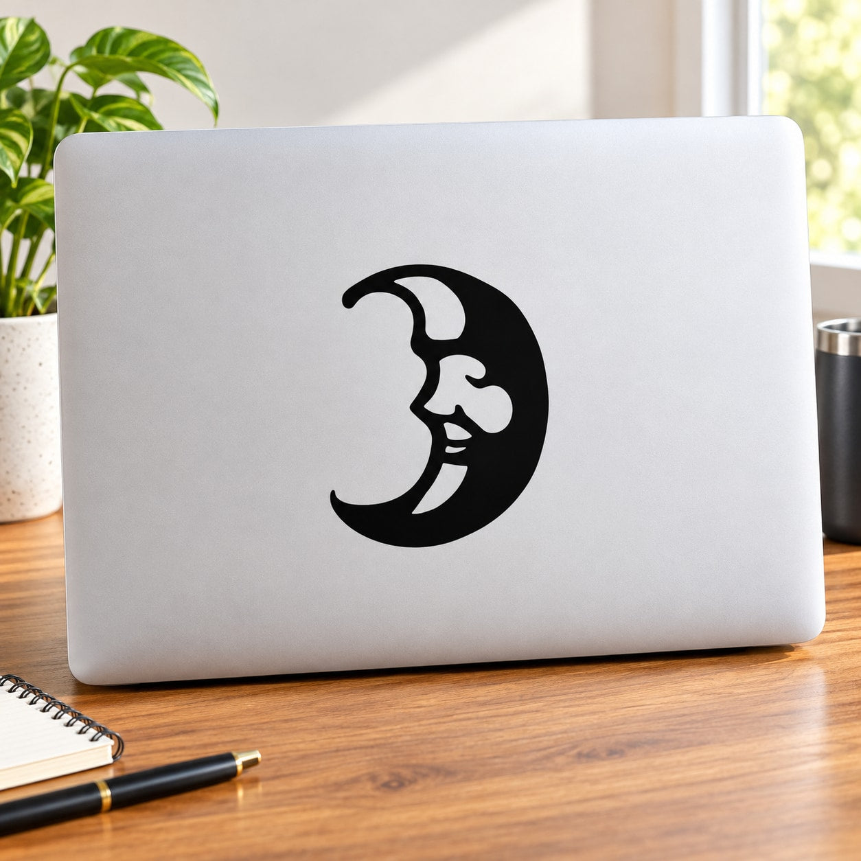 Cheerful moon decal: black smiling face moon on light laptop lid