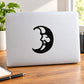 Cheerful moon decal: black smiling face moon on light laptop lid