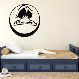 Worried moon decal: circular black cartoon face with worried expression