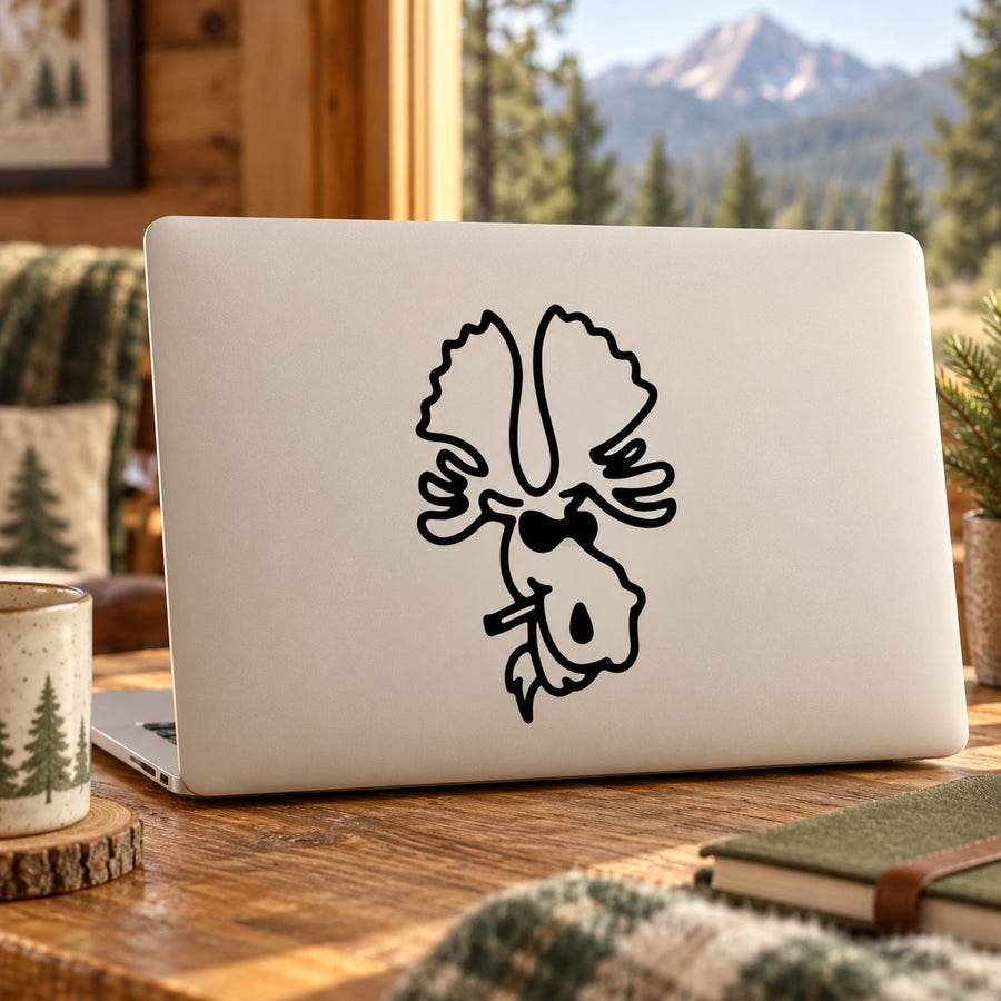 White laptop with black moose decal holding a cigarette on the lid