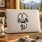 White laptop with black moose decal holding a cigarette on the lid