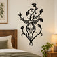Black skull floral wall decal with swirling leaves and bat-like shapes