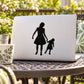 Silhouette decal of mother and daughter holding hands on laptop lid