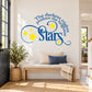 Blue wall decal with star crescent and the quote “The darkest nights produce the brightest stars”