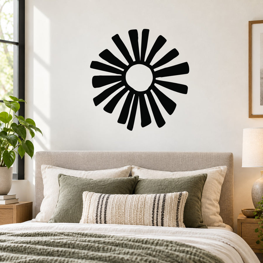 Sun flower wall decal with bold black sunburst rays and white center circle