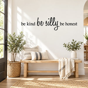 Wall decal with “be kind be silly be honest” cursive text