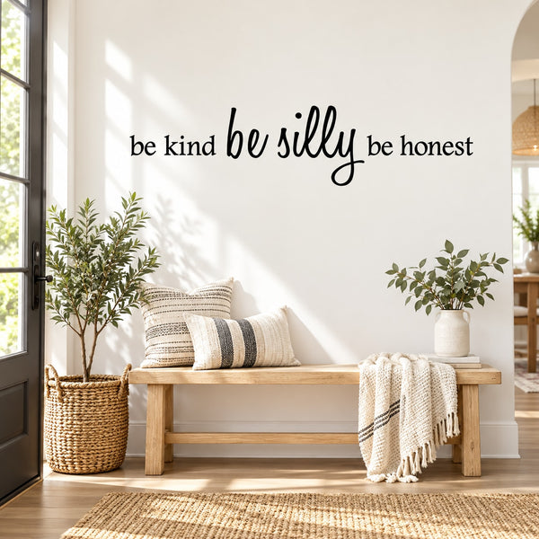 Wall decal with “be kind be silly be honest” cursive text