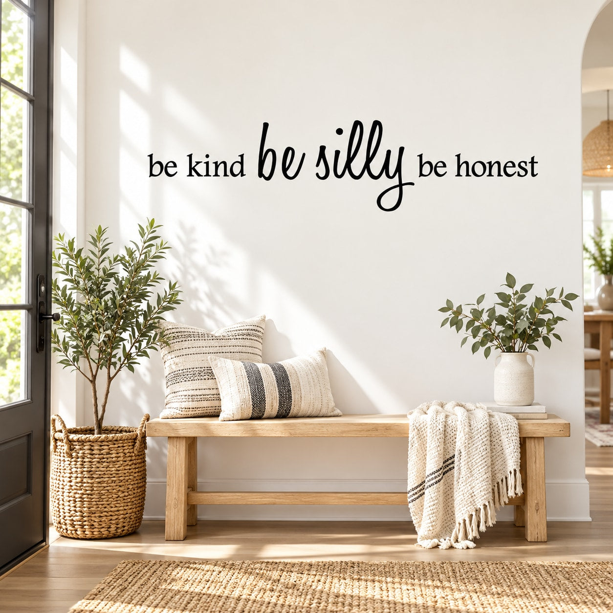 Wall decal with “be kind be silly be honest” cursive text