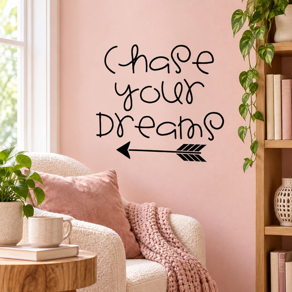 Wall decal with hand-lettered text "Chase your dreams" and arrow