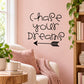 Wall decal with hand-lettered text "Chase your dreams" and arrow