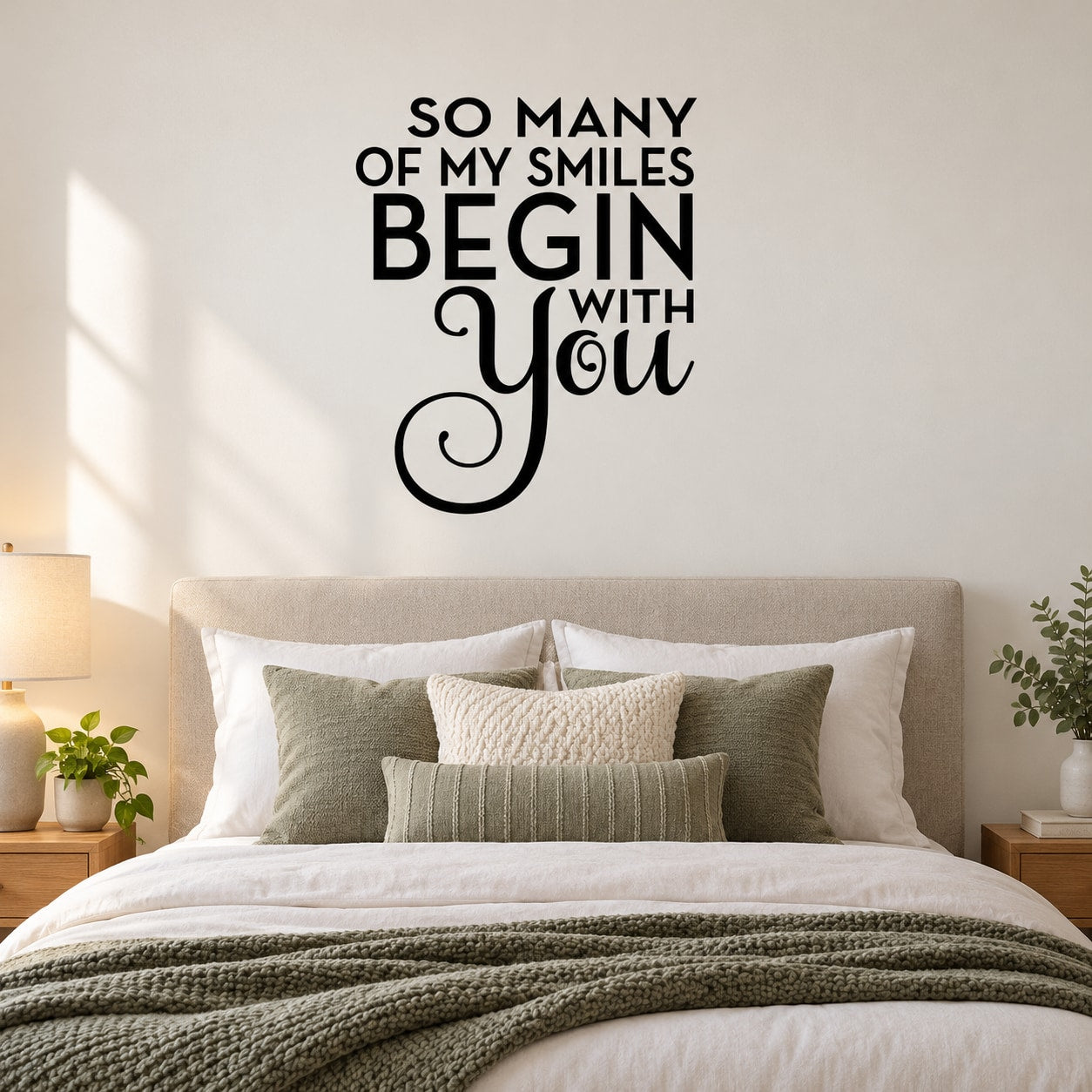 Wall quote decal with black text: 'So many of my smiles begin with you'