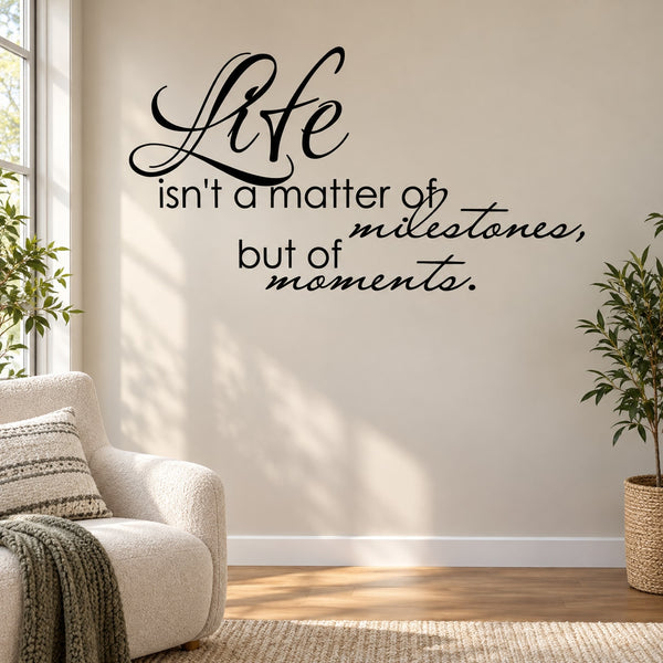 Inspirational wall decal with cursive quote: Life isn't a matter of milestones, but of moments.