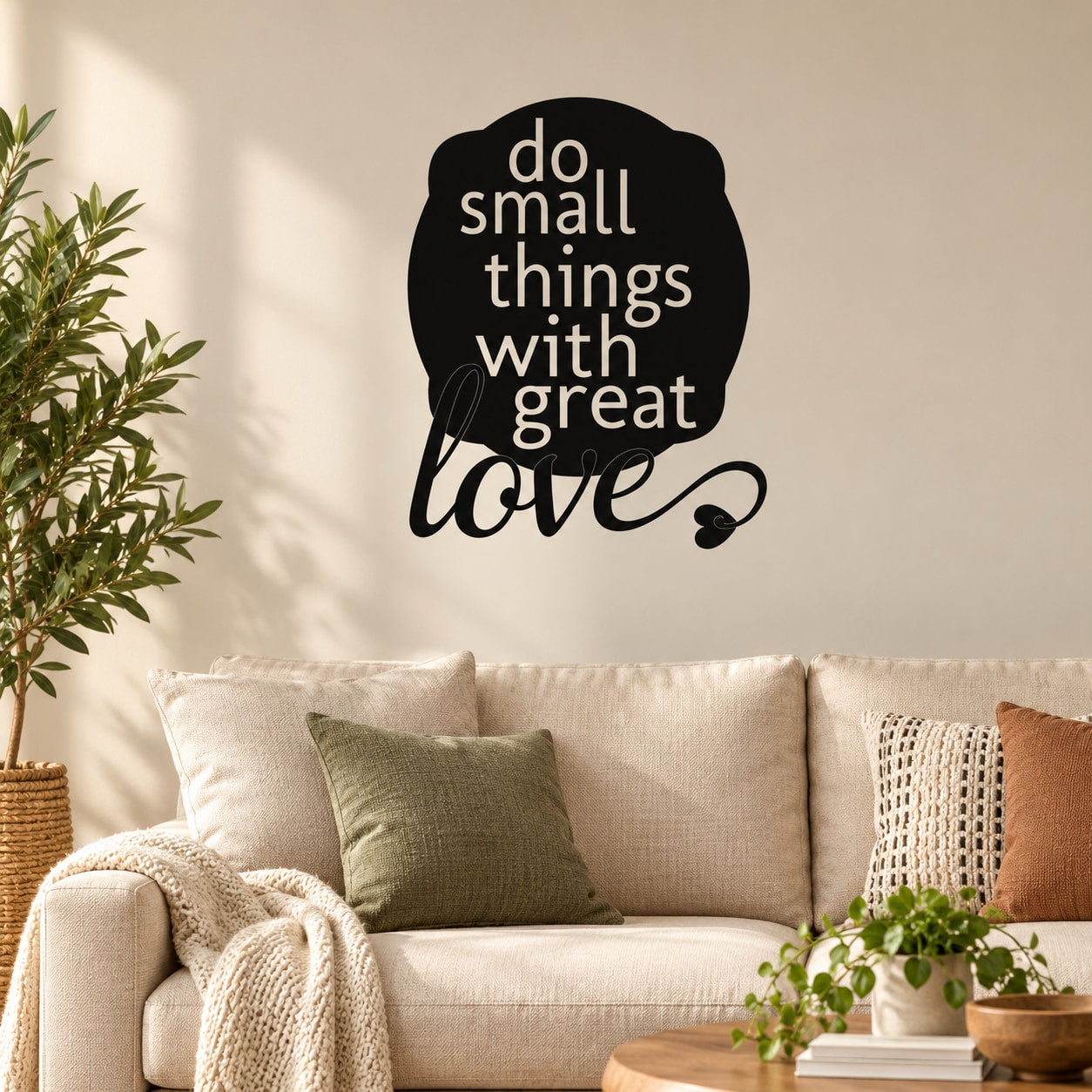 Wall decal with black circle and white quote: do small things with great love