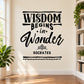 Black wall decal with "Wisdom Begins in Wonder" and "Socrates" script text