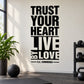 Wall decal with stacked black text: “TRUST YOUR HEART LIVE BY LOVE” and “E.E. Cummings”