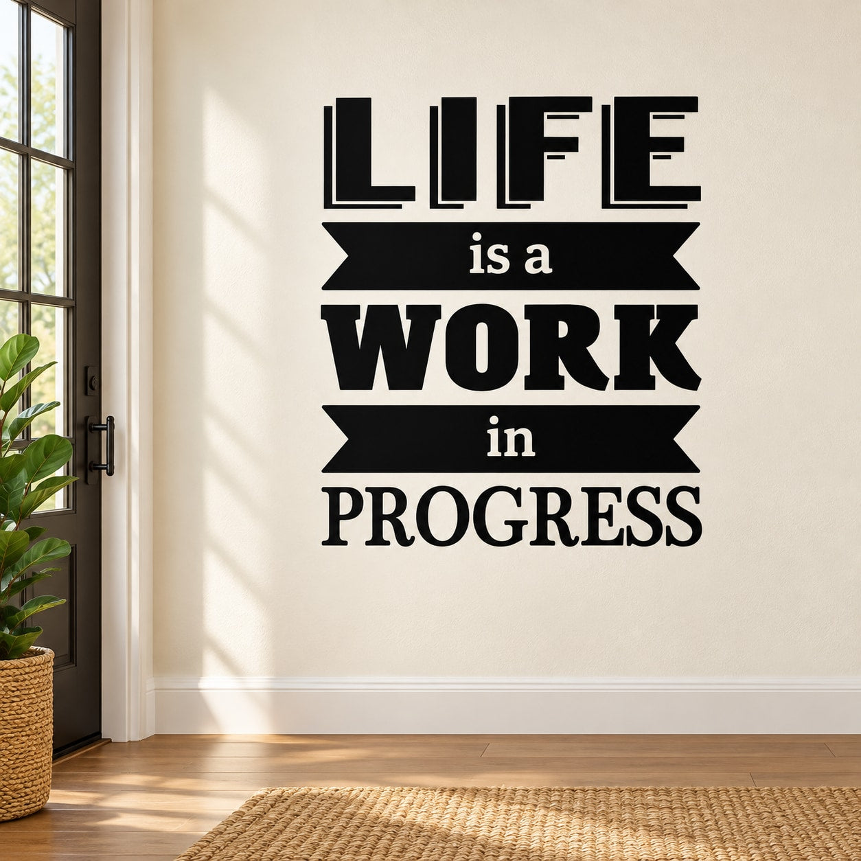 Black wall decal with stacked text: "LIFE is a WORK in PROGRESS"