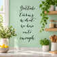 Gratitude wall decal, cursive quote: 'Gratitude turns what we have into enough'