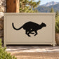 Black dashing mountain lion decal on rectangular tan sign