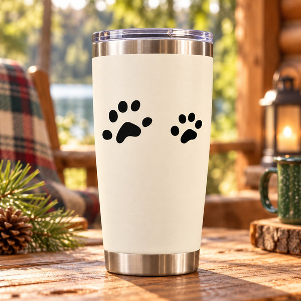 Mouse track decal with black paw prints on a metal travel tumbler