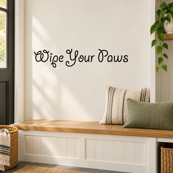 Black cursive wall decal reading "Wipe Your Paws"