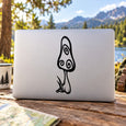 Mushroom-shaped vinyl decal in black outline on a light laptop lid