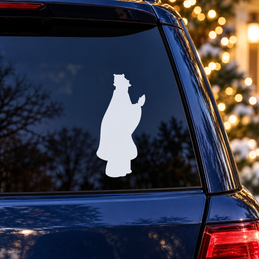 White Wiseman silhouette decal on a car window, standing figure with tall hat