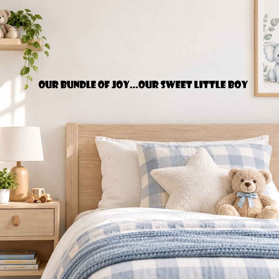 Black wall decal text: 'OUR BUNDLE OF JOY...OUR SWEET LITTLE BOY'