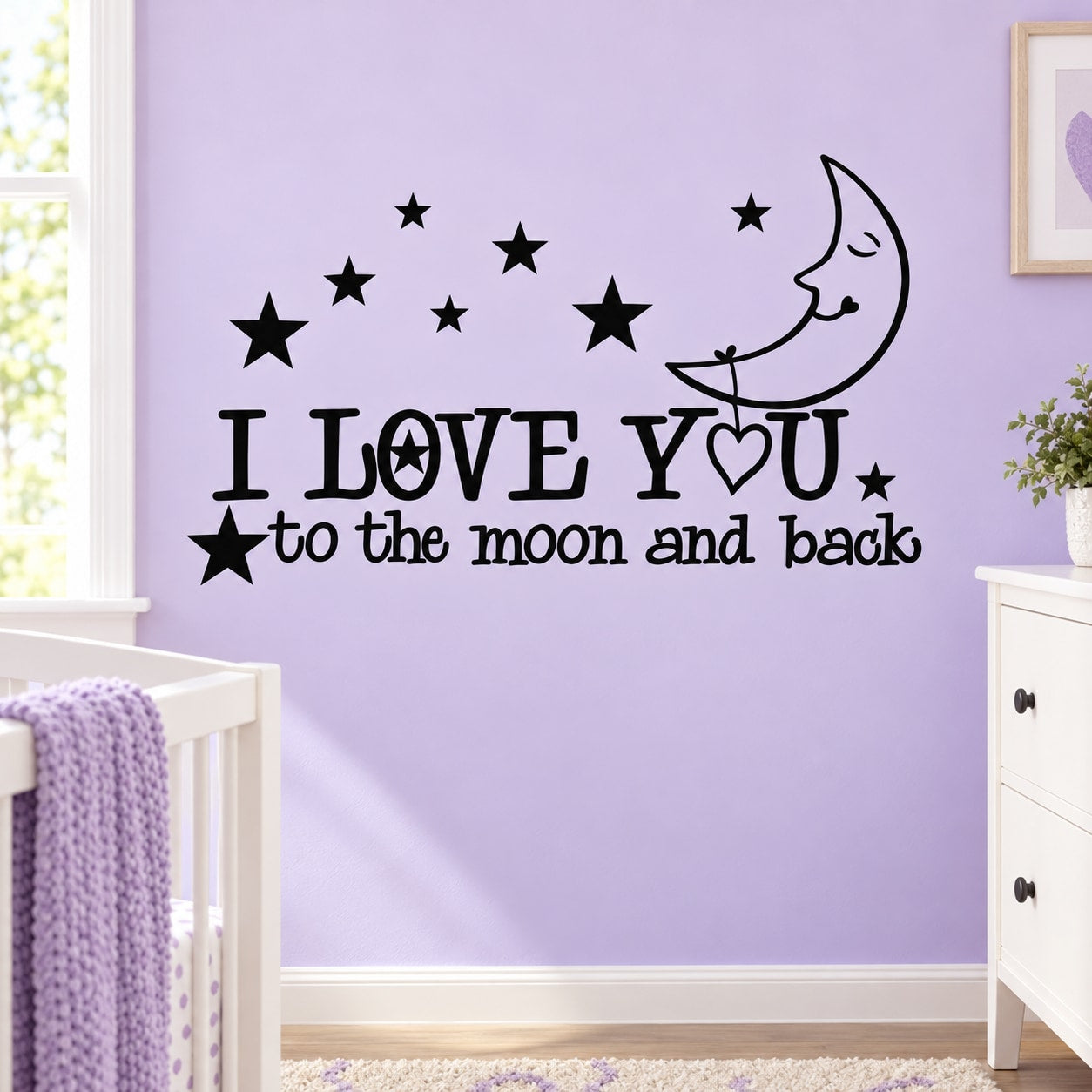 Wall decal with moon, stars, and text: I LOVE YOU to the moon and back