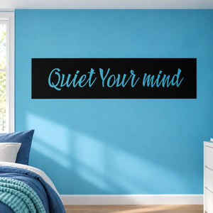 Wall decal with 'Quiet Your mind' text on a black rectangle