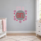 It’s a Girl wall decal with pink text and circular dot design