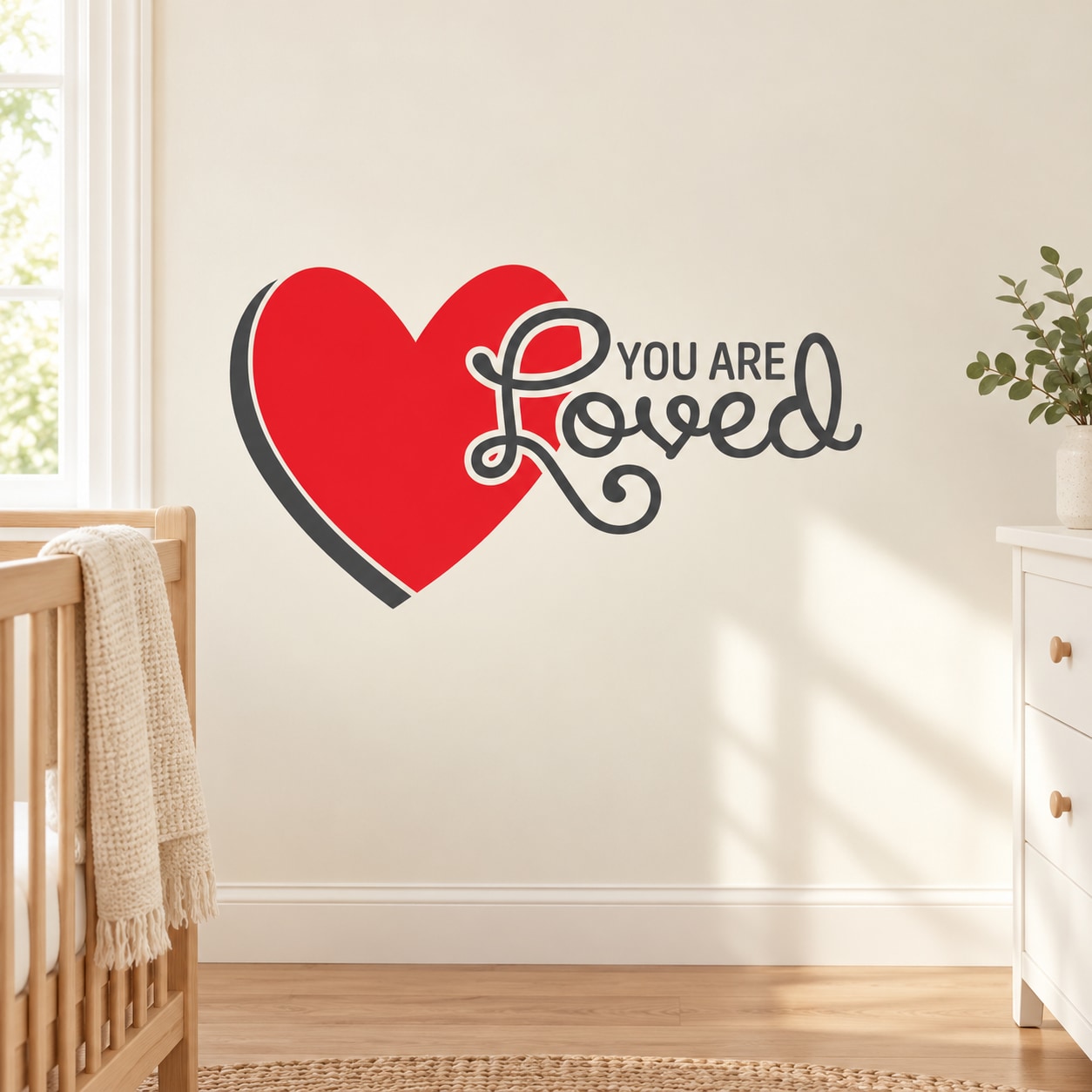Red heart wall decal with 'You are Loved' script in gray