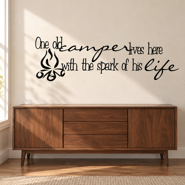 Wall decal with cursive quote and small camper icon in black