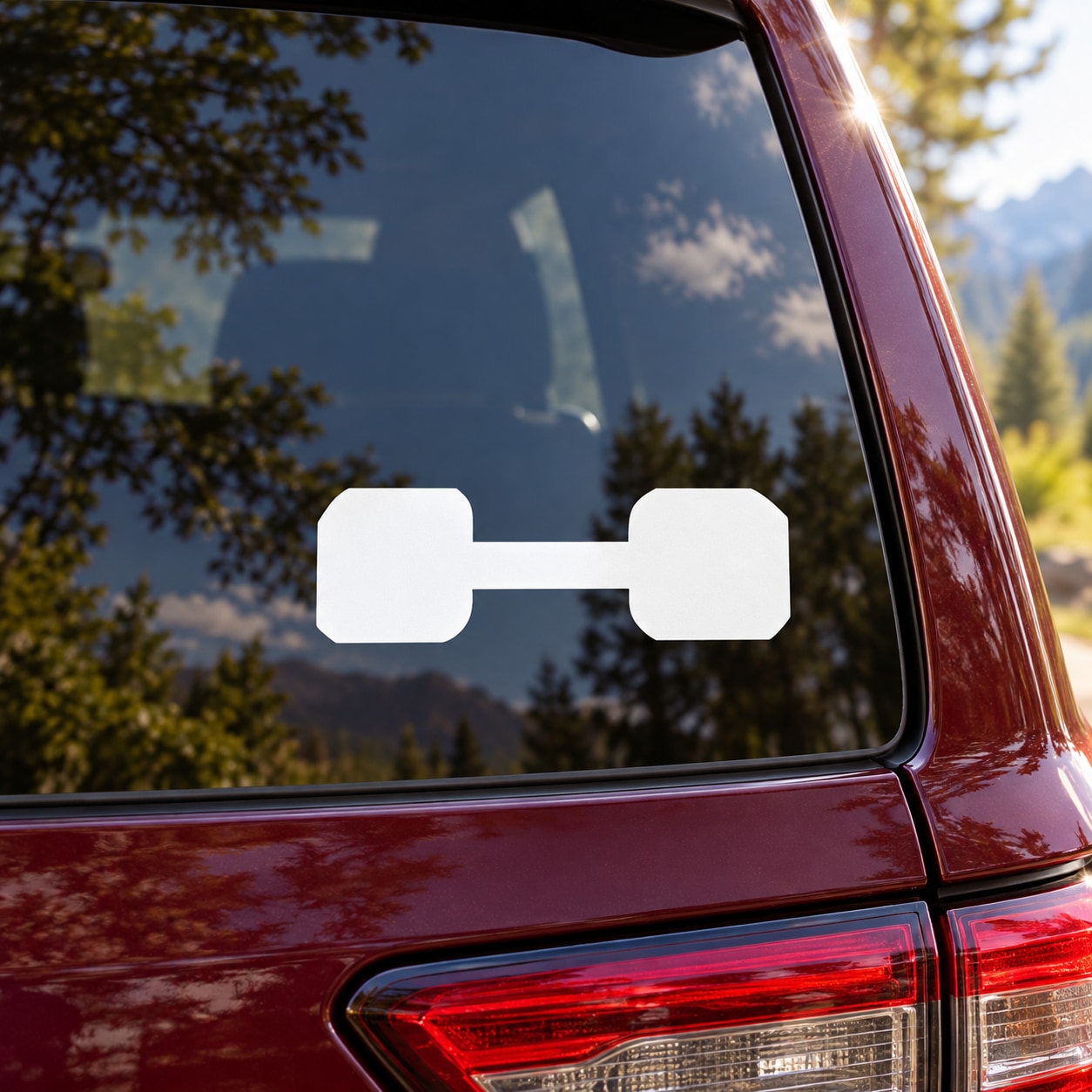 White dumbbell-shaped obedience decal on car rear window