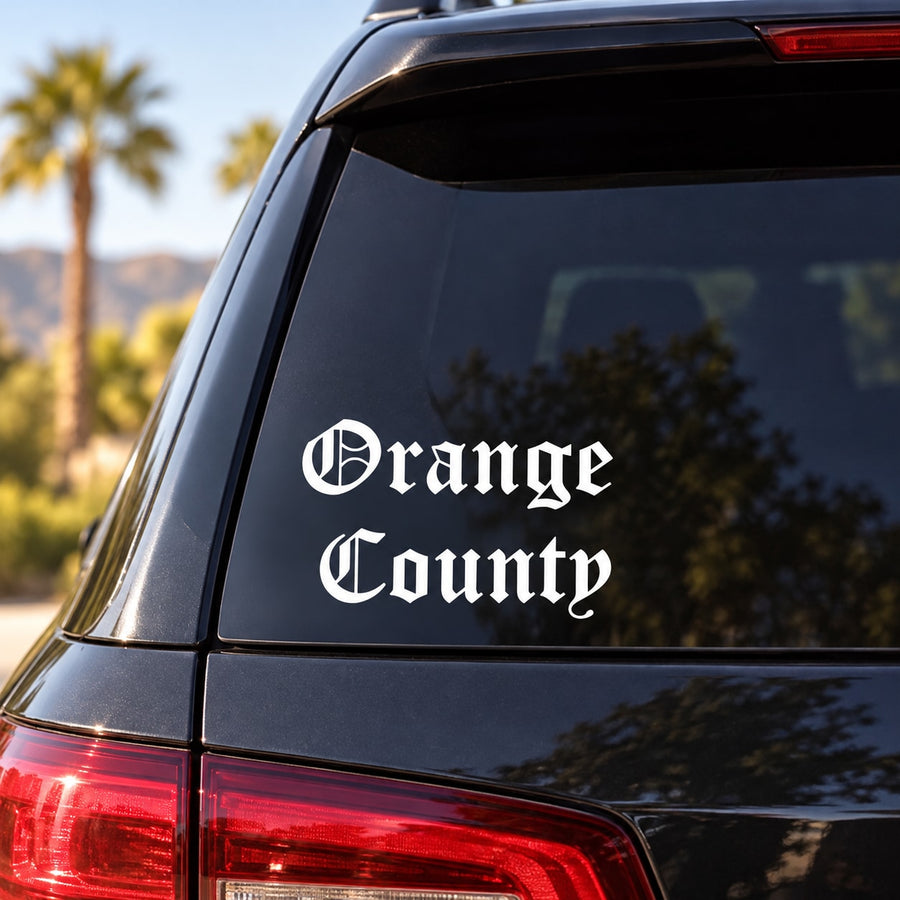 Orange County Old English Decal — illustrative vinyl decal application mockup. Surrounding objects are not included.