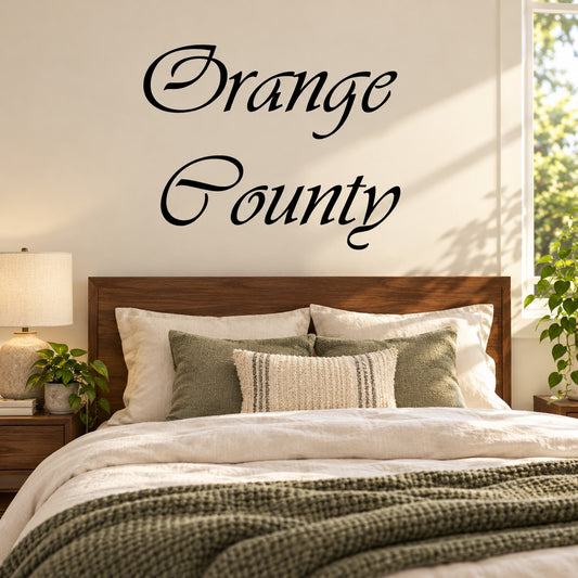Cursive vinyl decal with “Orange County” lettering in black