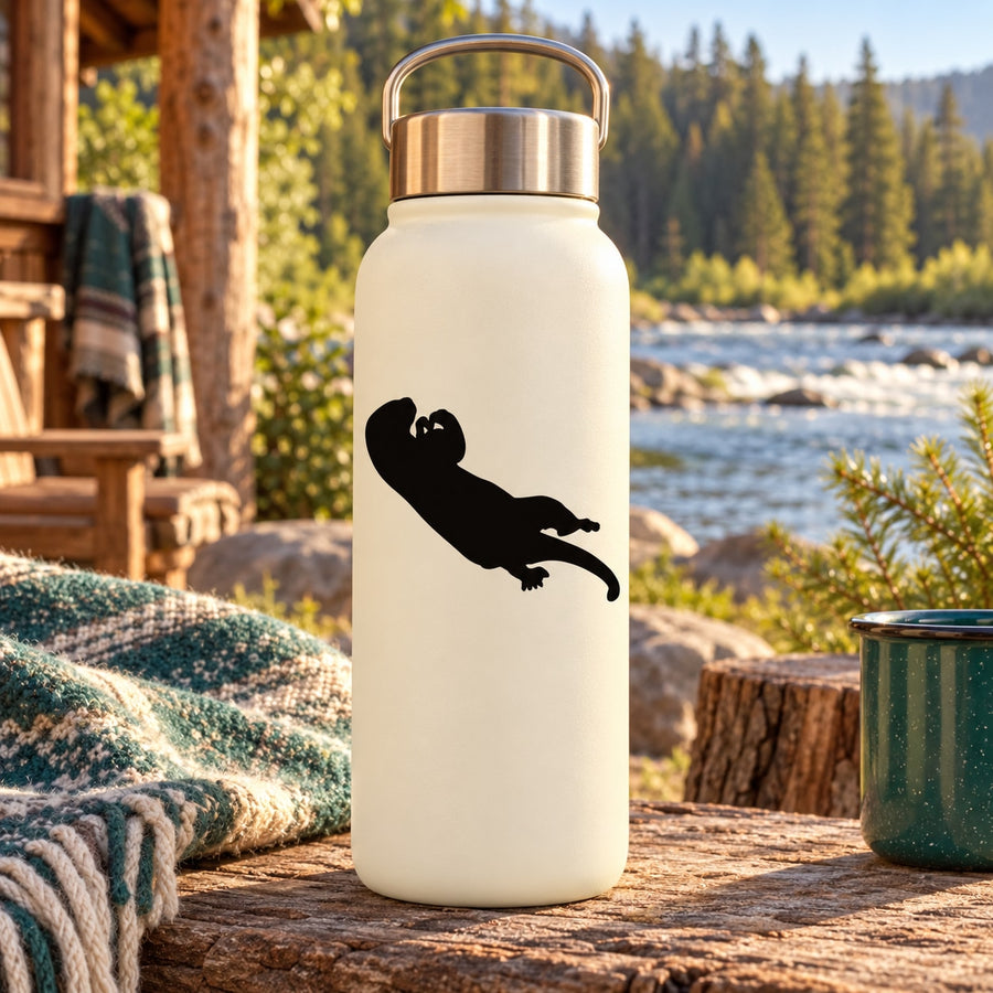 White reusable water bottle with black otter eating silhouette decal