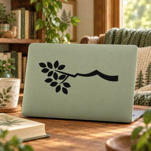 Leafy branch decal featuring black vine with leaves and curved branch on light board