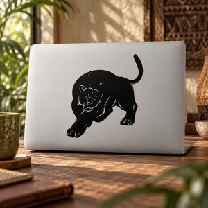 Black panther decal sticker with prowling animal silhouette on light laptop lid